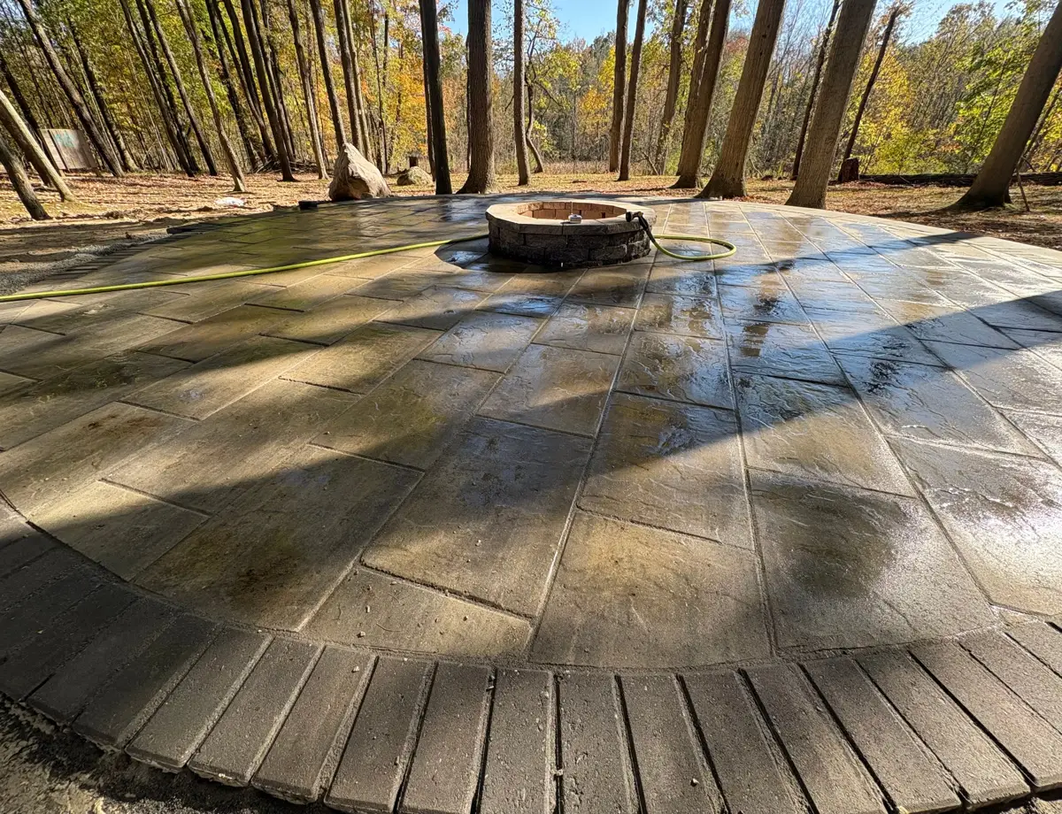 Finished paver patio with built-in stone fire pit